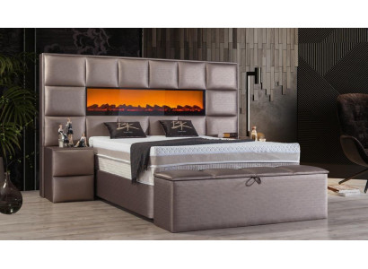 Elegante eigentijdse tweepersoonsbed met ruim gestoffeerd hoofdeinde.