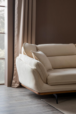 Beige bank gestoffeerde bank meubels banken woonkamer driezits textiel stof