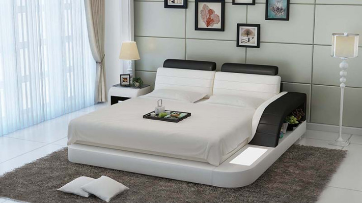Modern slaapkamerbed met hoogwaardig design, beddengoed, en multifunctionele USB-aansluiting.