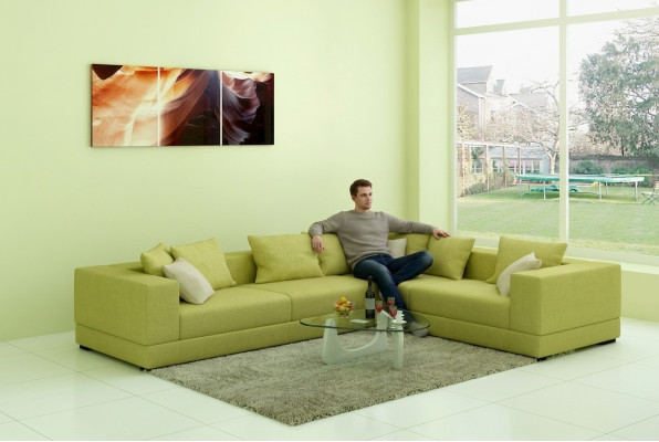 Moderne gestoffeerde stoffen bank in hoekbank design met stoffen bekleding