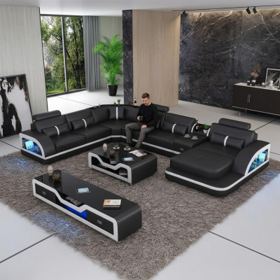 Hoekbank zwart met salontafel 2-delig. Woonkamer lederen bankstel hoekopstelling tafel