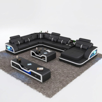 Hoekbank zwart met salontafel 2-delig. Woonkamer lederen bankstel hoekopstelling tafel