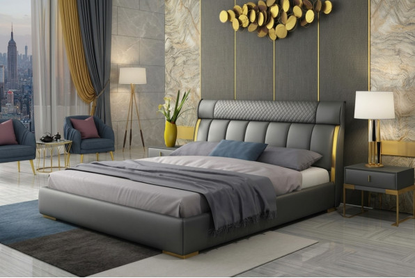Modern grijs leren slaapkamer met gouden roestvrijstalen accenten.