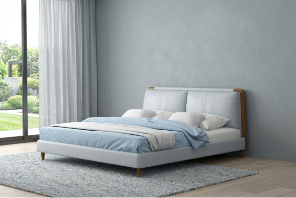 Moderne tweepersoonsbed van 180x200 in wit lederen design op houten poten.