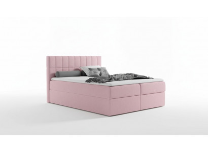 Roze stoffen boxspringbed met textielontwerp, modern tweepersoons hotelbed met opbergruimte.