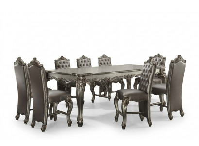 Grijze klassieke rechthoekige eettafel met 8 Chesterfield houten leren stoelen.