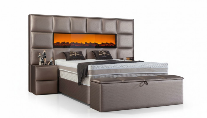 Elegante eigentijdse tweepersoonsbed met ruim gestoffeerd hoofdeinde.