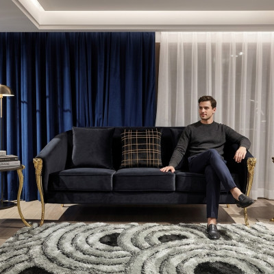 Driepersoons bank gestoffeerd meubilair fluweel luxe inrichting stoffen bankstellen.