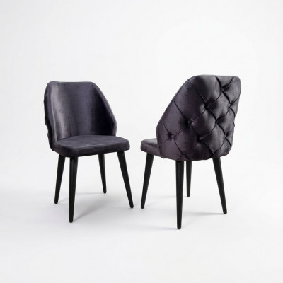Gevoerde houten stoel grijs Chesterfield op zwarte poten voor eetkamer.