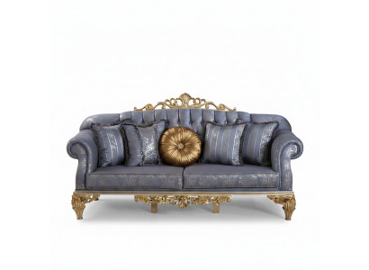 Veeleisende klassieke bank in Chesterfield-design voor de woonkamer met gouden kussens.