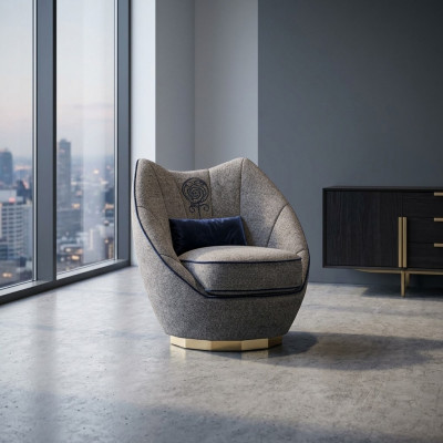 Luxe grijze fauteuil gestoffeerd met textiel voor de moderne inrichting van de woonkamer.