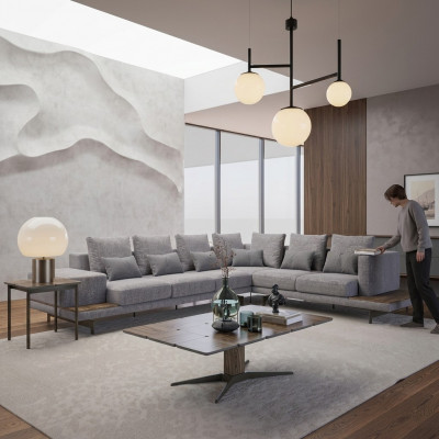 Luxe grijze hoekbank met houten salontafel en bijzettafel voor in de woonkamer.