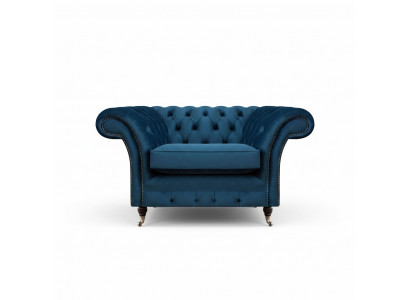 Blauwe woonkamer Chesterfield stoffen fauteuil luxe eenzitter stoffen meubel.